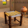Traditional handwoven wooden stools in Pakistan